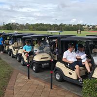 Golfers in buggies